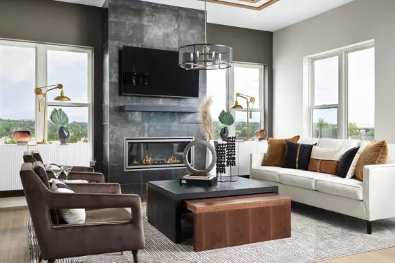 Modern living room with fireplace, sofa, and armchairs